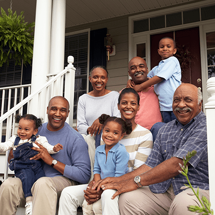 family sitting on porch step